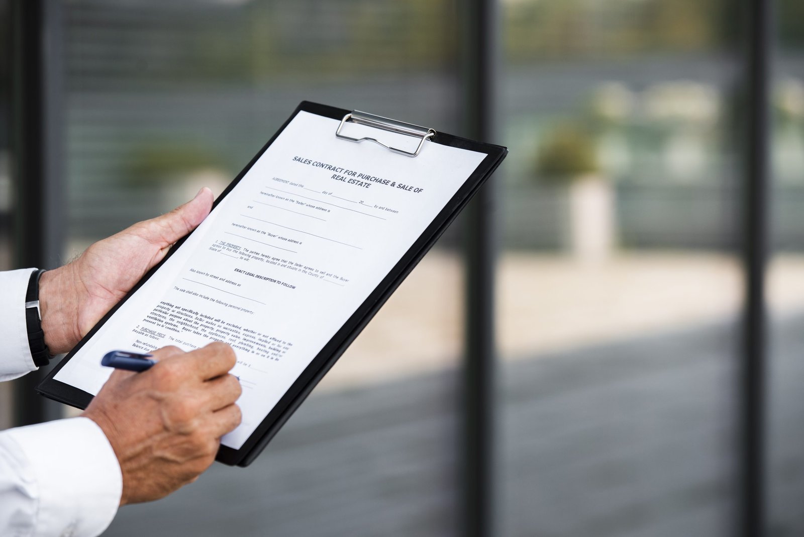 close up businessman writing clipboard