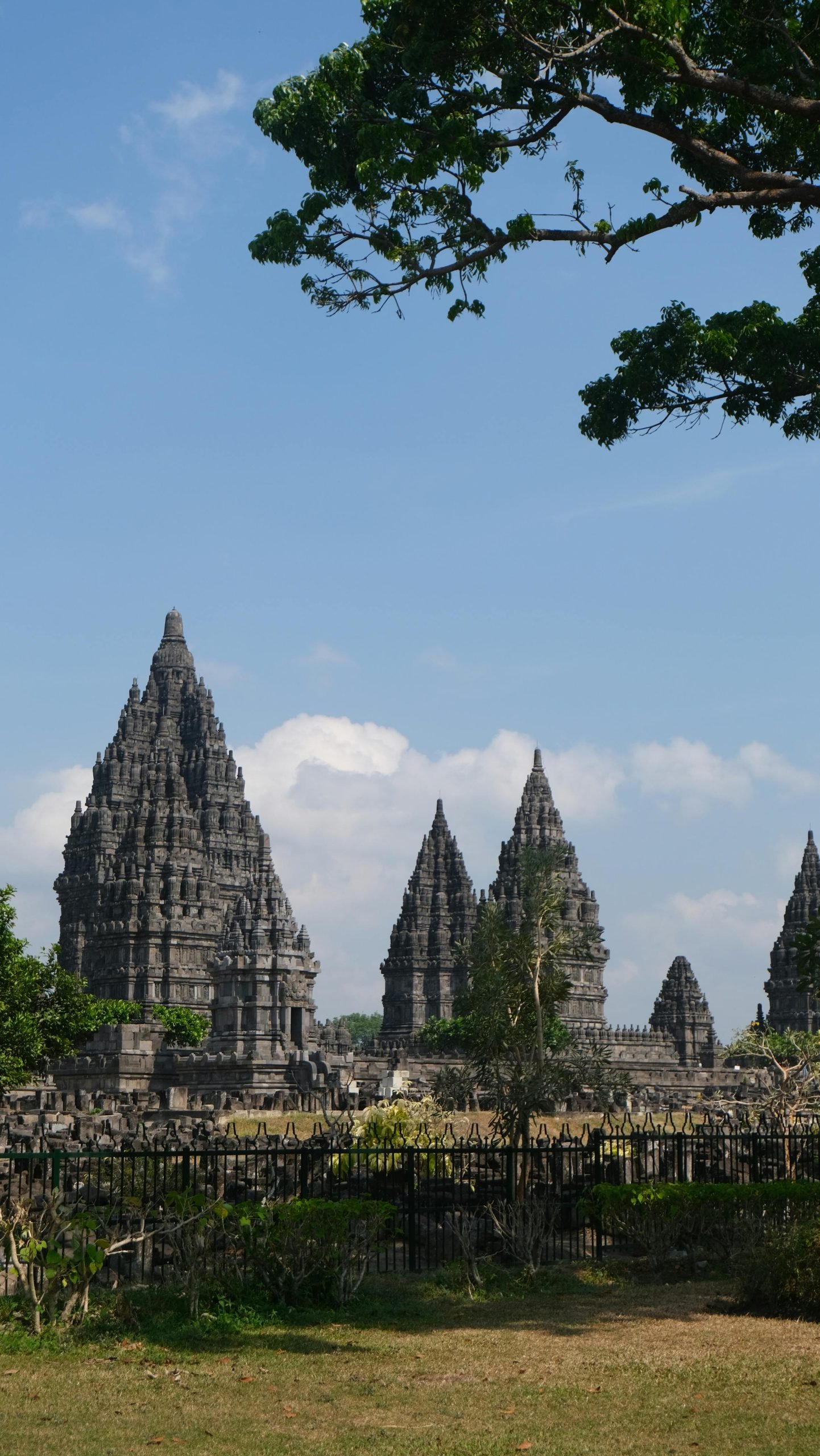 Discover Prambanan's ancient beauty in this vibrant outdoor shot of Indonesia's iconic Hindu temple.