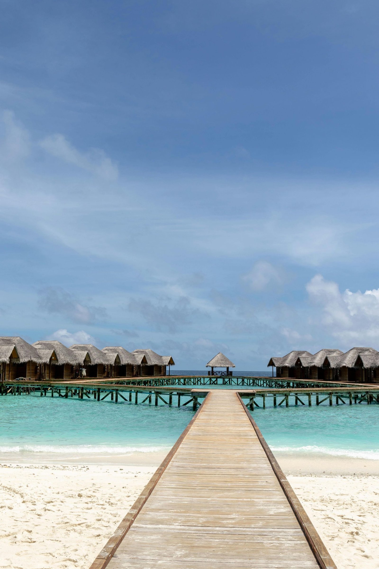 Idyllic view of overwater bungalows in the Maldives, perfect for travel and relaxation.